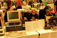 Byteshift's table, featuring an Altair 8800 and Osborne 1 connected to amateur radio equipment