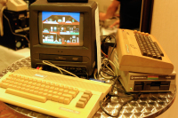 A lone C64 on a table playing Little Computer People